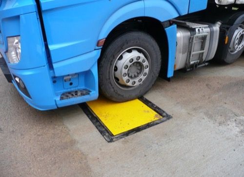 Truck driving over Dynamic Axle Weighbridge